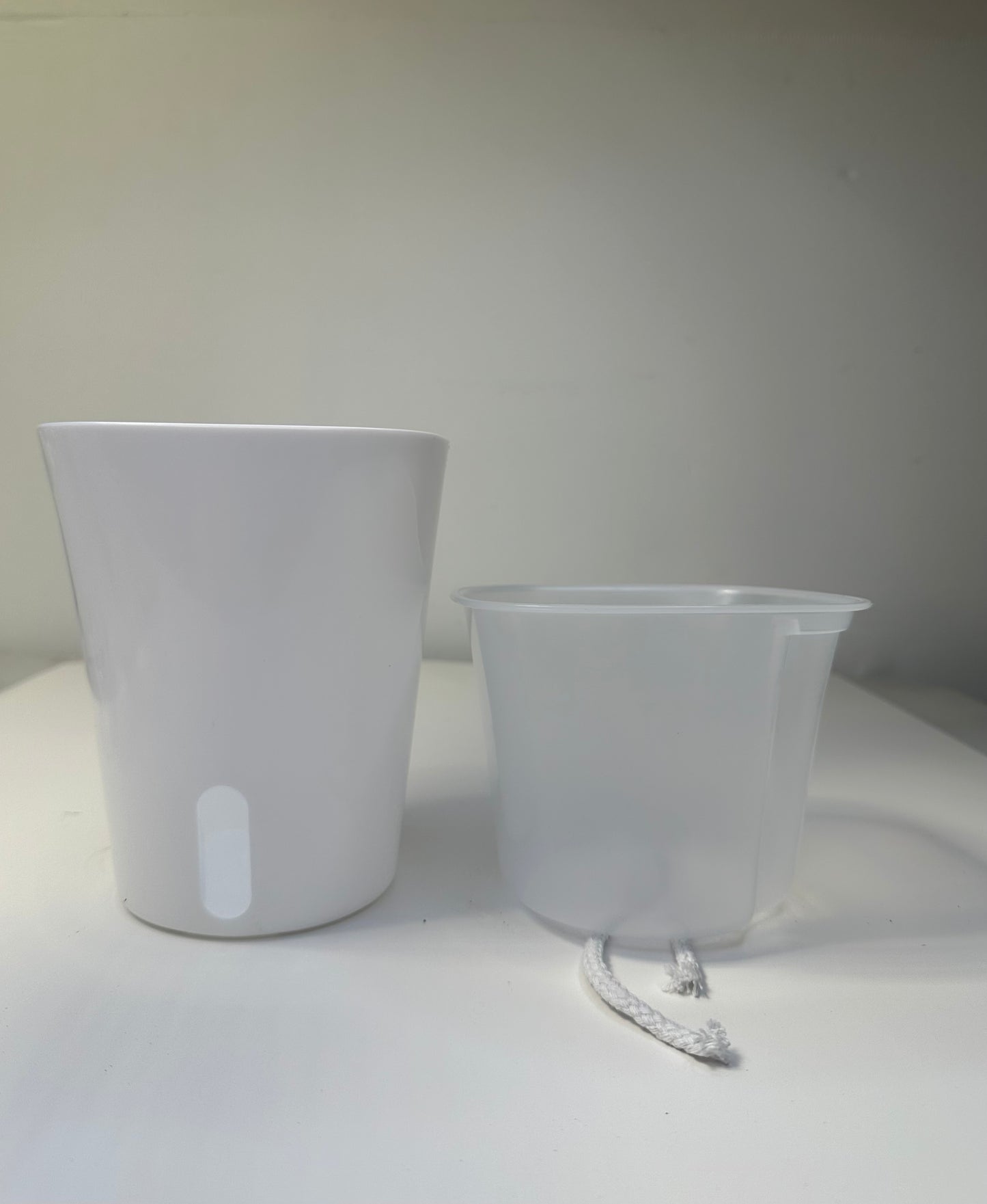 Self watering pots, transparent inserts