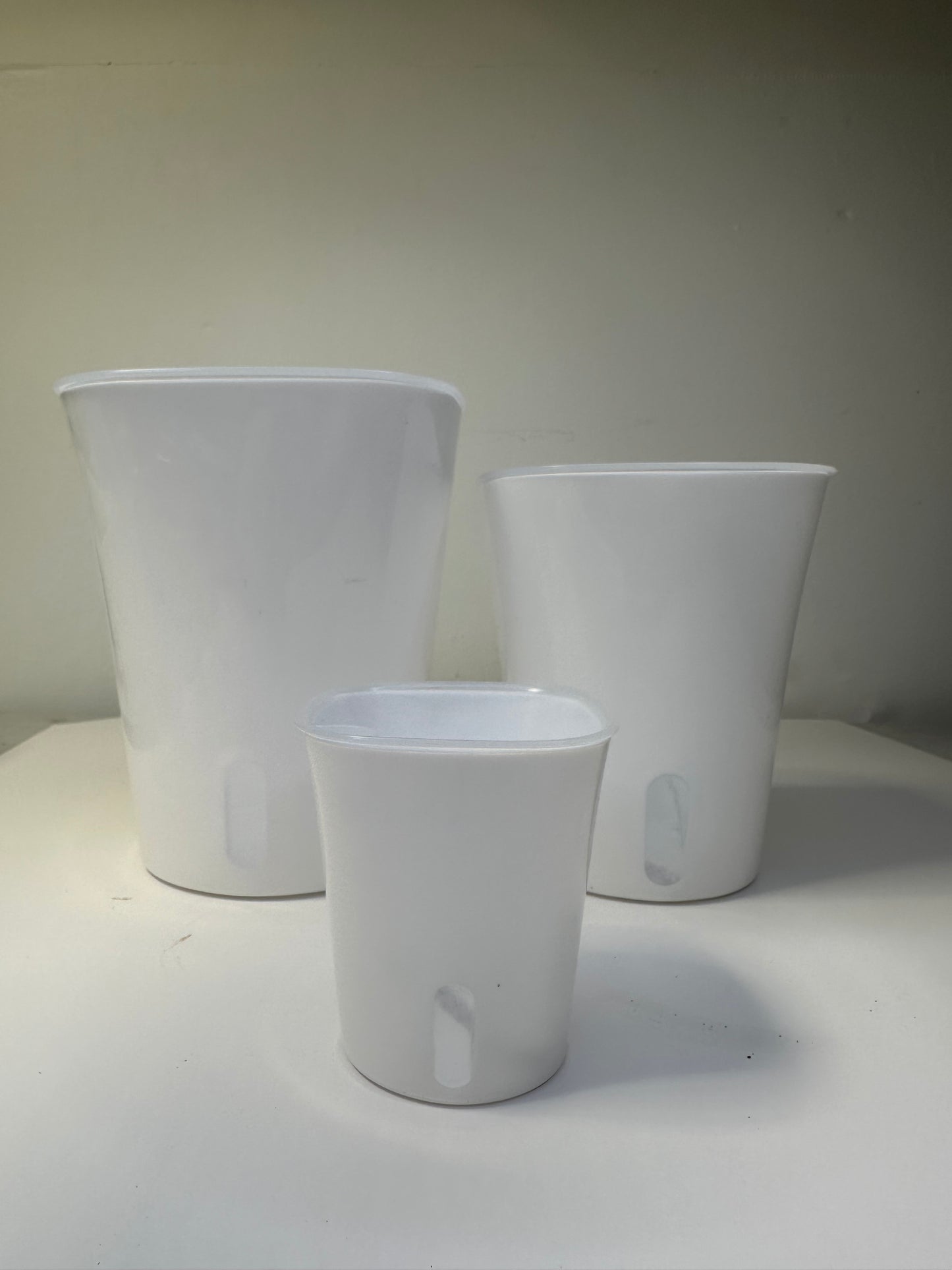 Self watering pots, transparent inserts